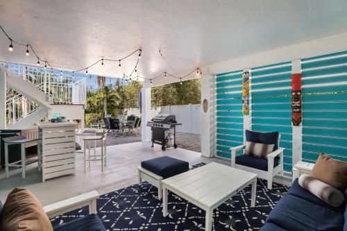 a living room with a blue and white wall at Beach You To It in Anna Maria