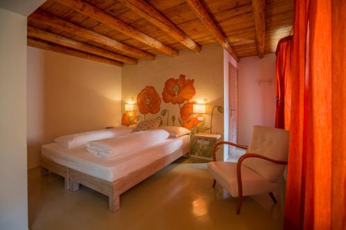 Кровать или кровати в номере Dormire alla Ruota
