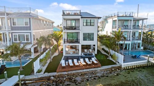an aerial view of a house with a swimming pool at Big Nauti in Bradenton Beach