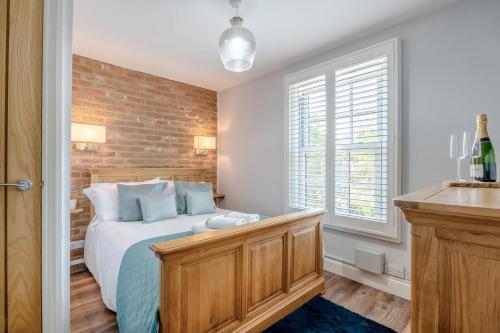 a bedroom with a bed and a brick wall at 1 Bed in Middlesbrough oc-79273 in Great Ayton