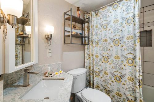 a bathroom with a toilet and a shower at KONA - Royal Kahili B205 End Unit - Gorgeous Views in Kailua-Kona