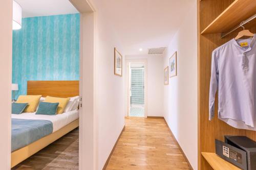 a bedroom with a bed and a closet at Maison Il Corso in Sorrento