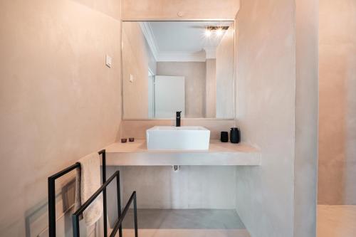 a bathroom with a sink and a mirror at Quinta da Berlica - Alentejo in Estremoz