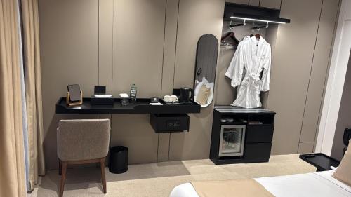 a dressing room with a mirror and a dressing table at Centrale Hotel in Tirana