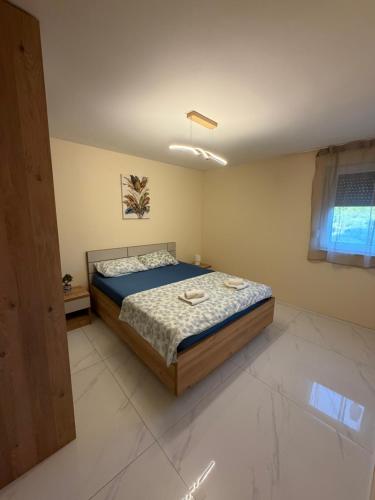 a bedroom with a large bed in a room at Villa Asa with private Jacuzzi in Vir