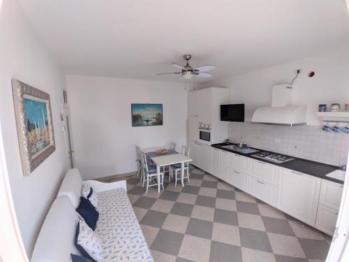 a kitchen with a couch and a table in a room at Maréthias in Punta Marina