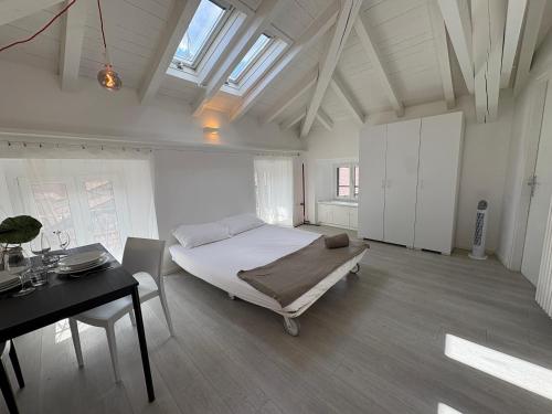 a bedroom with a bed and a desk in it at Appartamento San Rocco in Intra