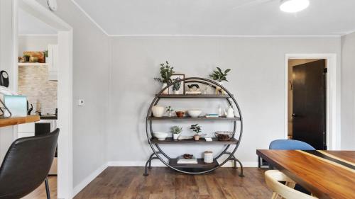 a dining room with a round shelf on the wall at West Bench Retreat in Red Lodge