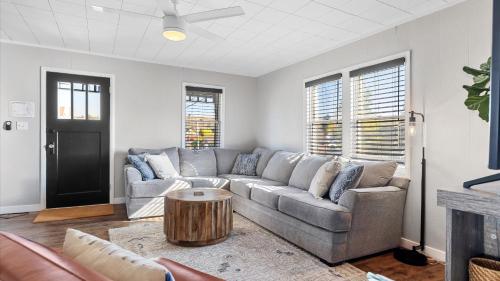 a living room with a couch and a table at West Bench Retreat in Red Lodge