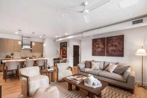 a living room with a couch and a table at Refined Big Sky Luxury Condo in Big Sky