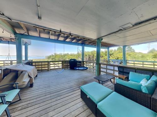 a deck with couches and tables on a boat at Sandcastle Townhomes #24 in Navarre