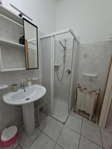 a bathroom with a shower and a sink and a shower at NumanaPaceeMare in Numana