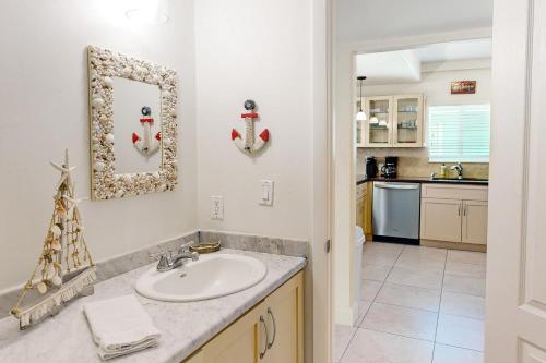 a bathroom with a sink and a counter at KC28 Fantastic Fifth Street in Key Colony Beach