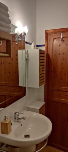 a bathroom with a sink and a mirror at Finca Blanca Formentera in Sant Francesc Xavier