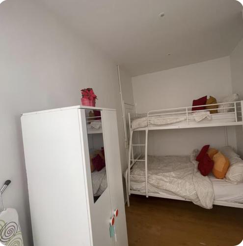 a room with two bunk beds and a closet at Grace Family Home 2 in Brussels