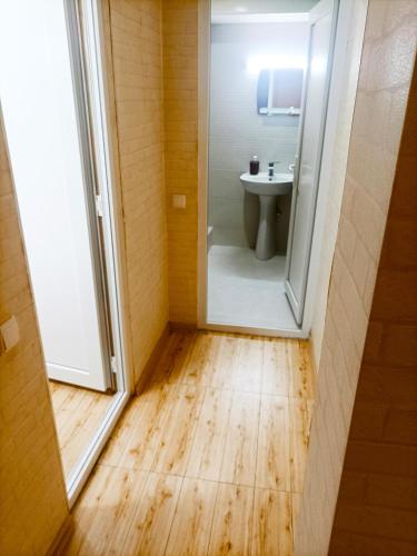 a bathroom with a shower and a toilet and a sink at Cozy Corner in Borjomi