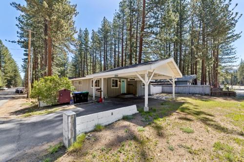 a small house with awning in front of trees at Cozy Pines & Paths Retreat in South Lake Tahoe