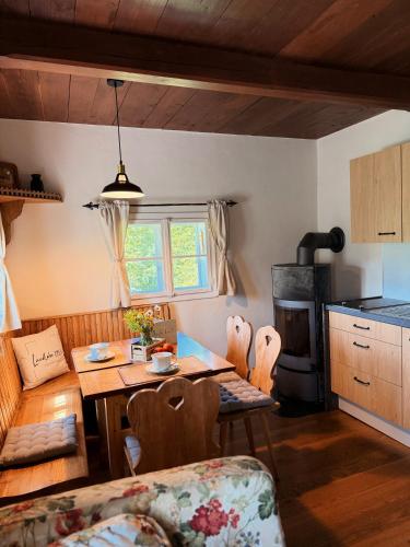 a kitchen and dining room with a table and chairs at Ferienhaus Landliebe 1753 in Bad Gleichenberg