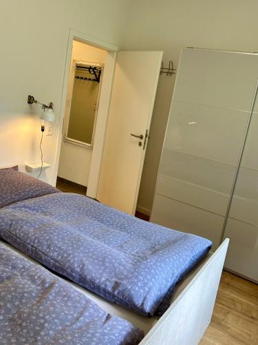 a bedroom with two beds and a closet at Ferienwohnung Spitze Warte in Rüthen