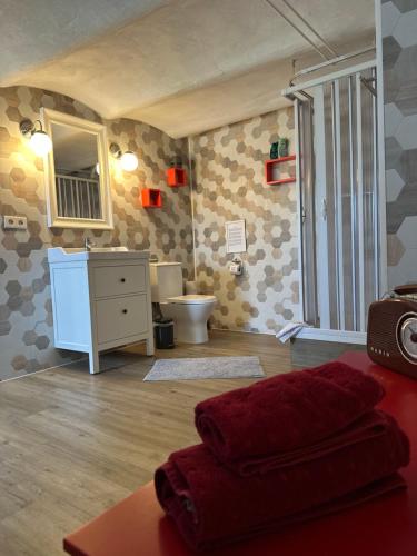 a bathroom with a sink and a toilet in a room at Ferienwohnung Westerburg in Westerburg