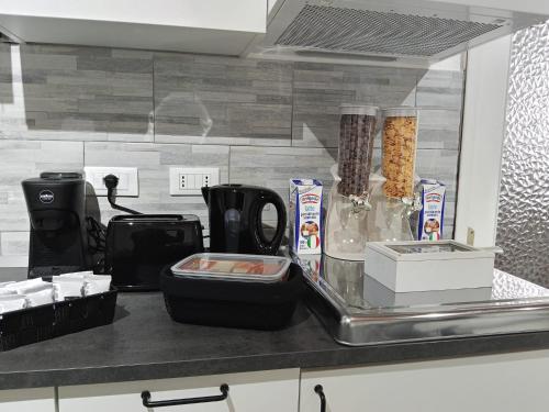 a kitchen counter with a counter top with some food at G&G Giusy e Gabry in Viverone