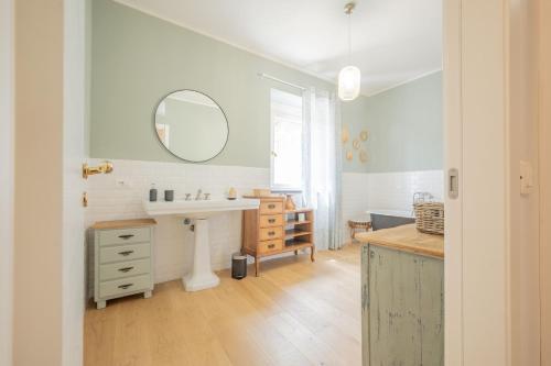 a bathroom with a sink and a mirror at Villa Eremo Cinque Terre in Castiglione Chiavarese