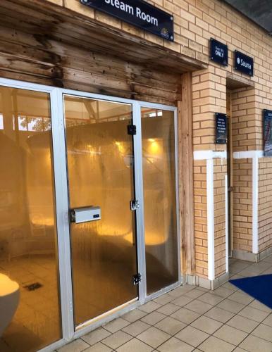 an entrance to a building with a revolving door at Poppy in Ferndown