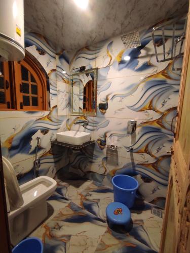 a bathroom with a sink and a toilet at HOTEL FABULOUS KASHMIR, Dal lake in Srinagar