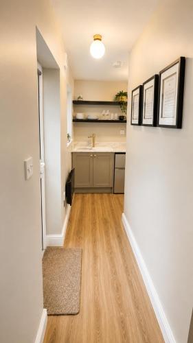 a kitchen with a sink and a counter at Central Apartments Cannock in Cannock