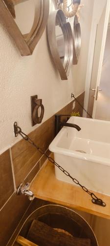 a bathroom with a sink and a mirror at Il borghetto di Lele & Schina in Arvier