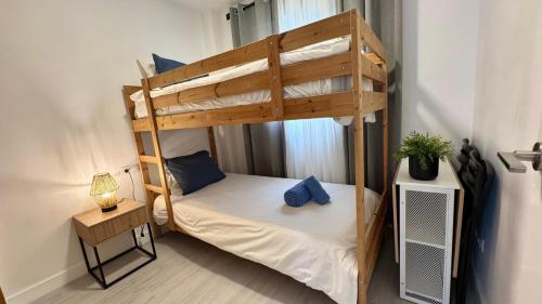 a small bedroom with a bunk bed in a room at San Miguel Centro in Torremolinos