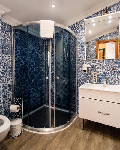 a bathroom with a shower and a sink at Ayder Doga Resort in Ayder Yaylasi