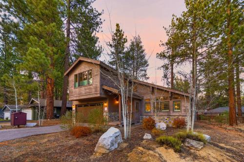 a log home in the woods with trees at Chalet Near The Tahoe Keys in South Lake Tahoe