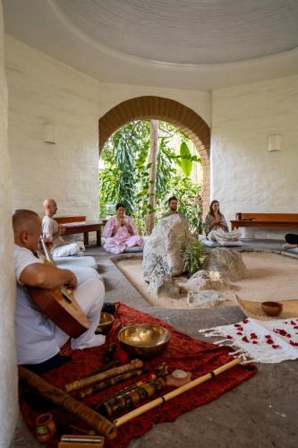 a group of people sitting in a room at Mision del Sol Resort & Spa Adults Only in Cuernavaca