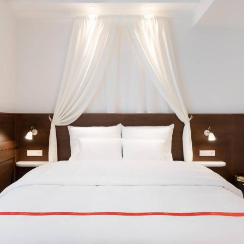 Lova arba lovos apgyvendinimo įstaigoje Ruby Rosi Hotel Munich by IHG