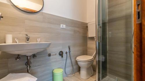 a bathroom with a sink and a toilet at Hotel Anny in Cervia