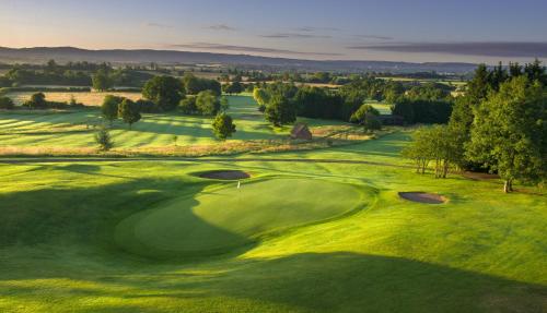 an overhead view of a golf course with a green at Tewkesbury Park in Tewkesbury