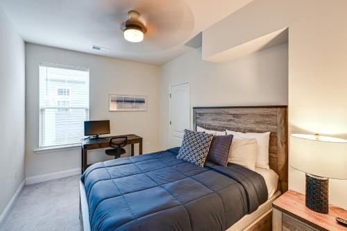 a bedroom with a bed and a desk and a window at Beach Shuttle! Spacious Bishop’s Landing Retreat in Ocean View