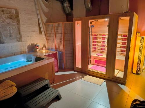 a bathroom with a shower and a sink and a tub at iRelax studio - privatni wellness in Prague