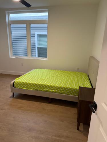 a bed in a room with a window at 2 Bedroom Apartment in Seaside Heights