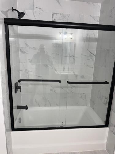 a glass window with a person in the background at 2 Bedroom Apartment in Seaside Heights