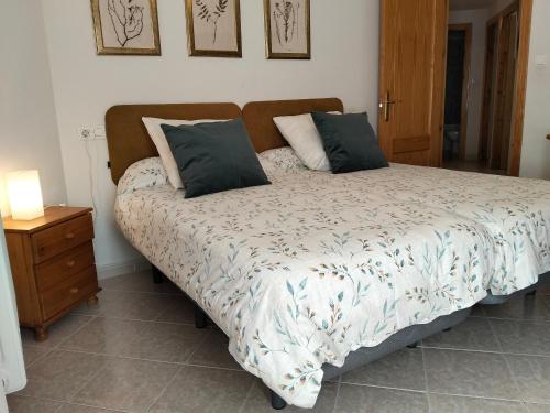 a bed with two pillows on it in a bedroom at Best Biescas Tourist Home in Biescas