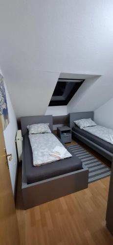 a bedroom with two beds in a room at Apartment in Bergheim