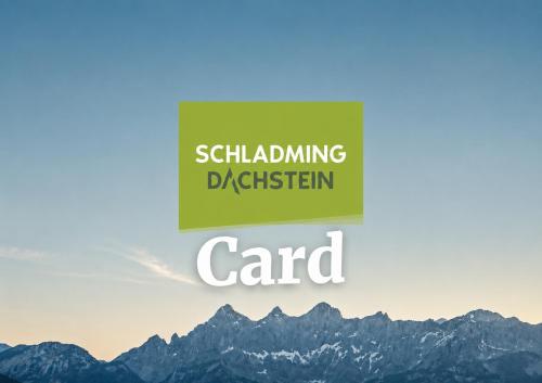 a sign that reads attending disaster card with mountains in the background at Appartements Luna in Schladming