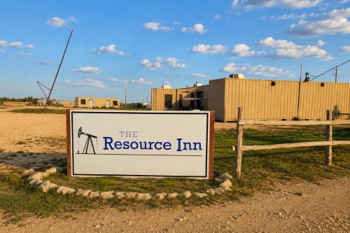 a sign for the resource inn in the desert at The Resource Inn Big Lake in Big Lake