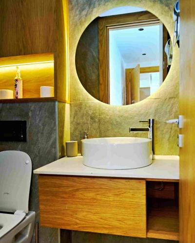 a bathroom with a sink and a mirror at Prestige studio in Maarif