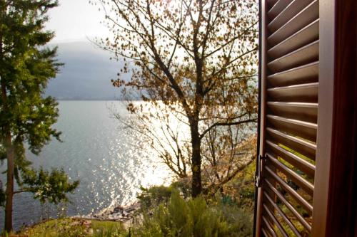 a view of a lake from a house at Lakefront Villa Del Pierangelo in Cremia