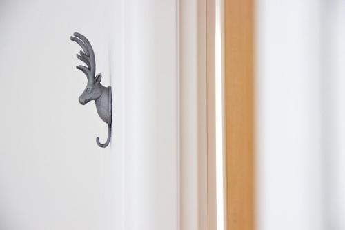 a door handle with a deer head on it at Lakefront Villa Del Pierangelo in Cremia