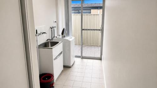 a bathroom with a sink and a toilet at Napolean Holiday Retreat in Vasse
