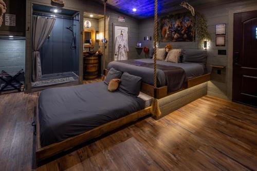 a bedroom with two beds in a room at "Squirrels Gone Wild" Luxury Treehouse Adventure Near Dollywood & Pigeon Forge in Sevierville